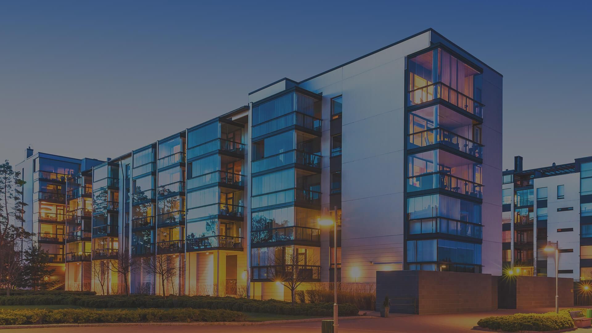 Modern multi-storey building at dusk